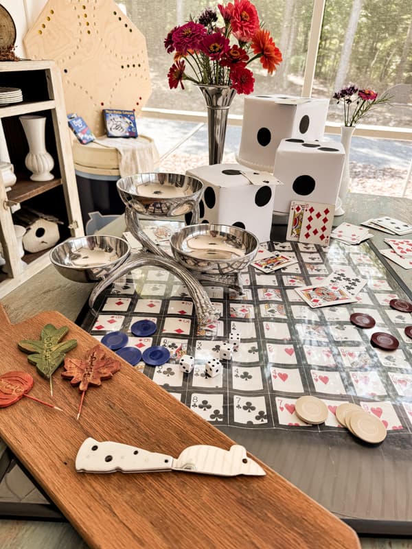 Add a game board and DIY Dice to create a festive game night table setting.  