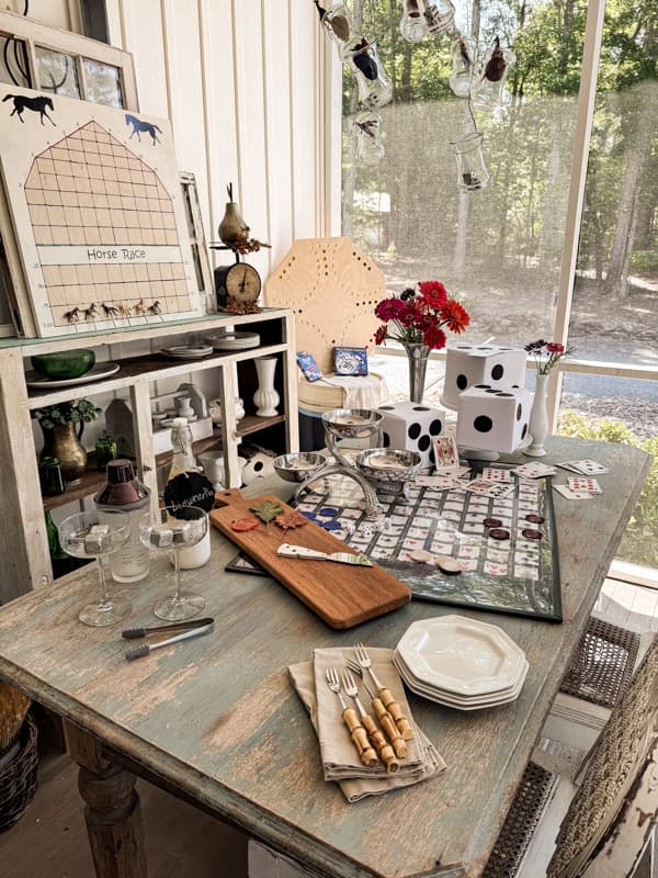 Game Night Table decorations with game boards and cards and DIY Dice.  