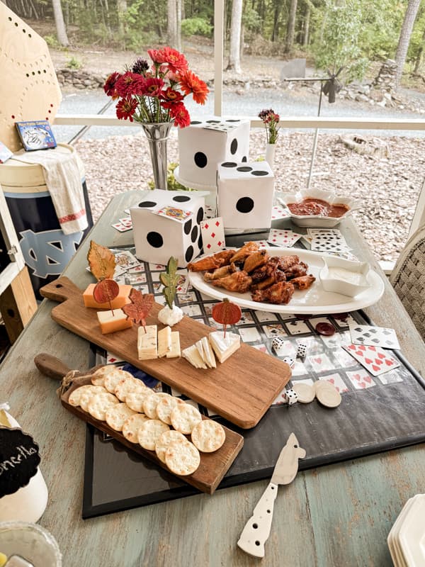 Game Night Party Decorations with DIY dice, cards, and game boards.  Cheese tray and chicken wings appetizers.  