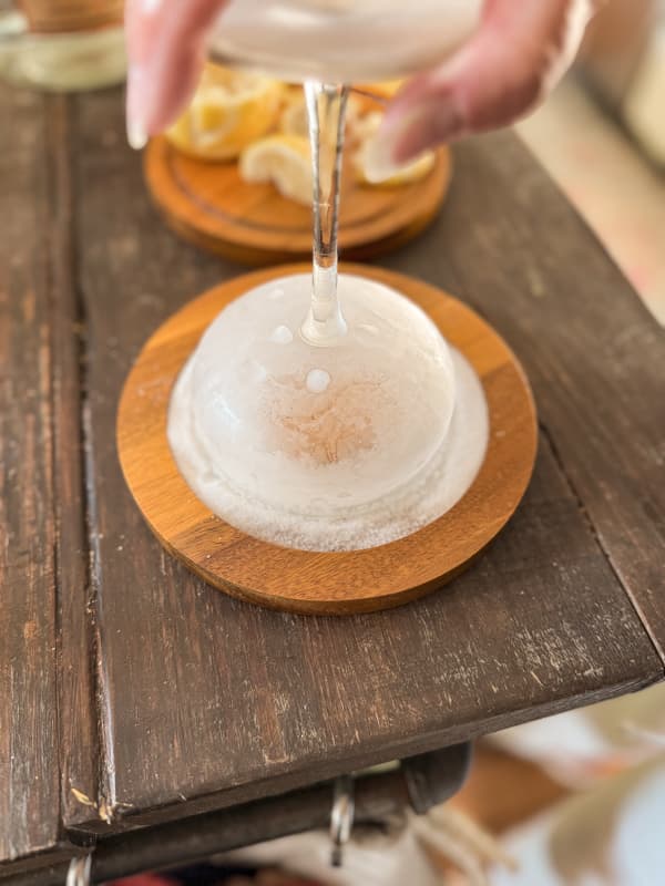 Add sugar to the rim of the cocktail glass with a sugar rimmer tray.  