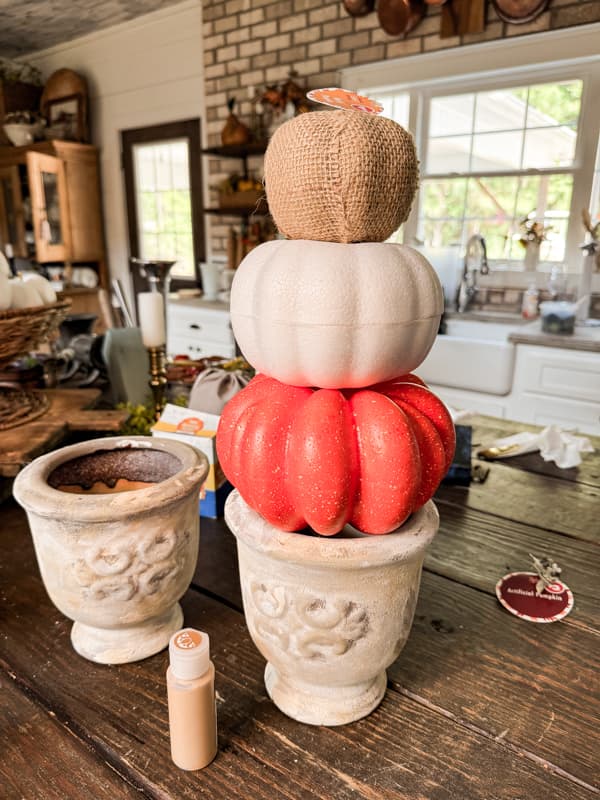 DIY Pumpkin Topiaries made with Dollar Tree Pumpkins, burlap and old book pages.  