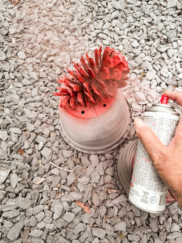 Spray paint the foraged pinecones with three different colors of paint.  