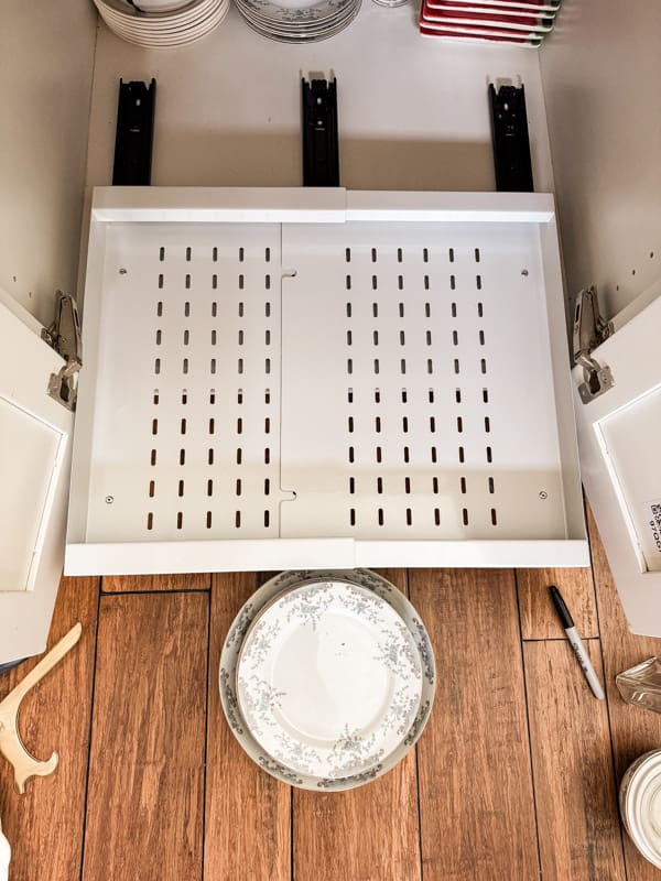 Add pull out drawers for ease of finding stored tableware.  