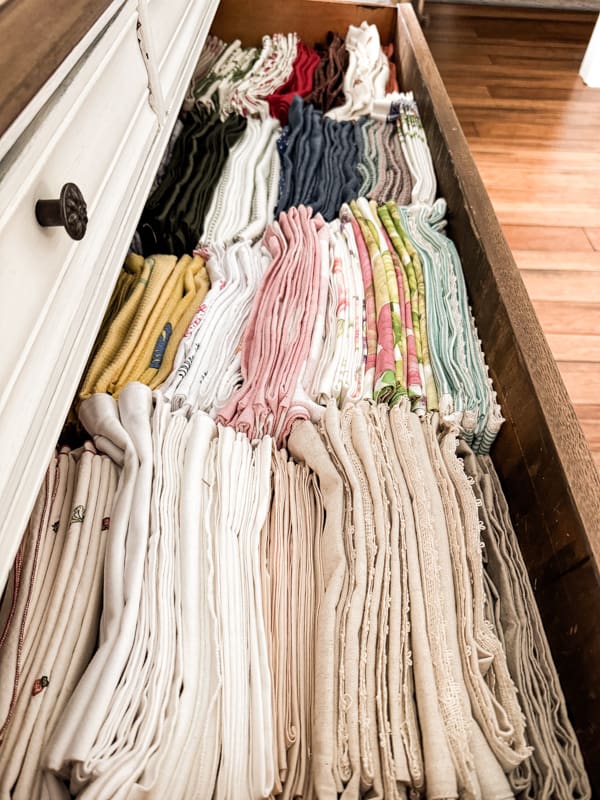 Use vintage dresser to store table linens and napkins