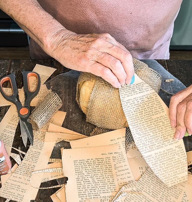 attach old book page over the burlap pumpkin