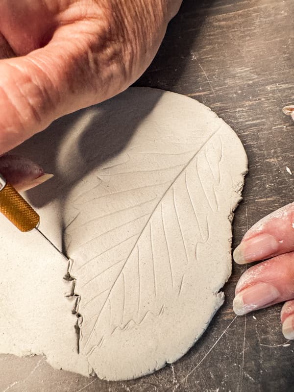 Use exacto knife to cut the leaf shape from the air-dry clay to make DIY Cheese Markers