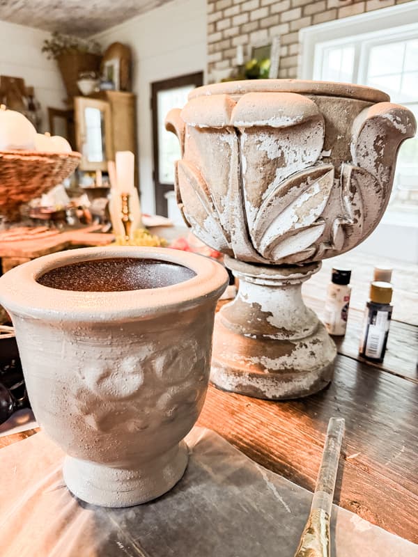 vase painted beige with inspiration vessel in background