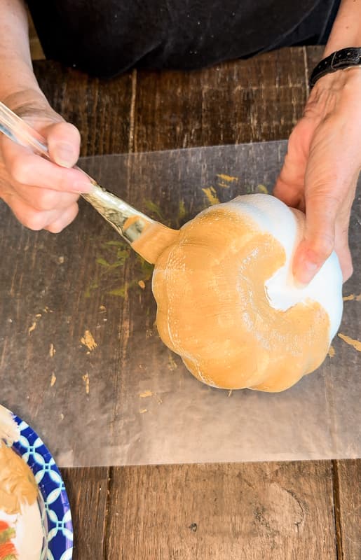 Paint the Dollar Tree Pumpkin before adding the burlap.