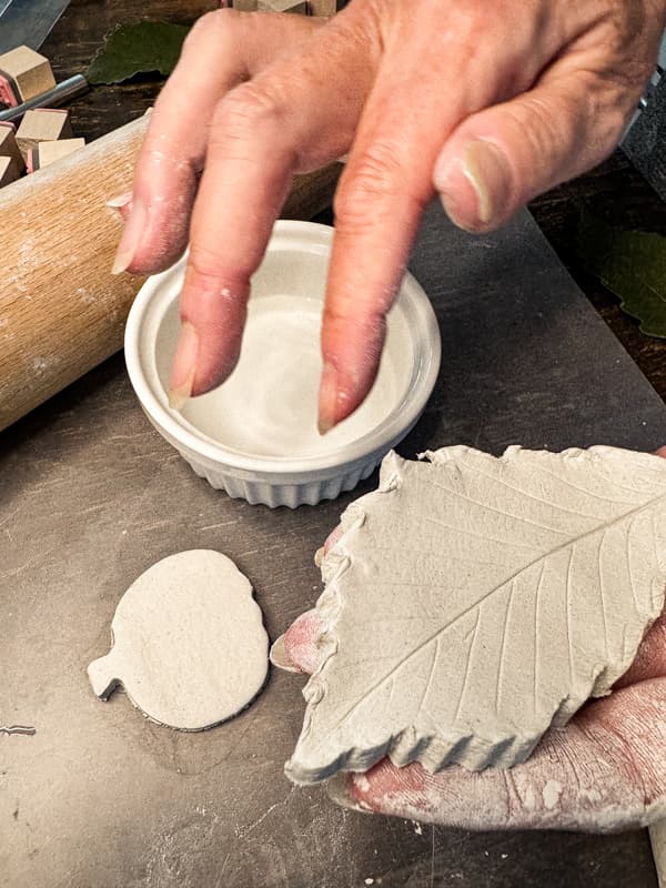 wet fingertips to smooth rough edges of the air-dry clay