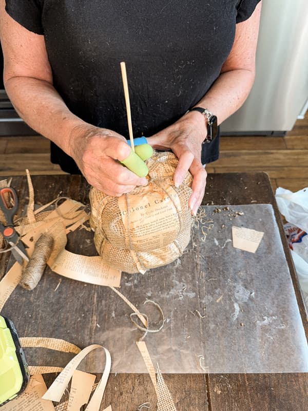 Run a bambo skewer into the center of the DIY pumpkin Topiaries.  