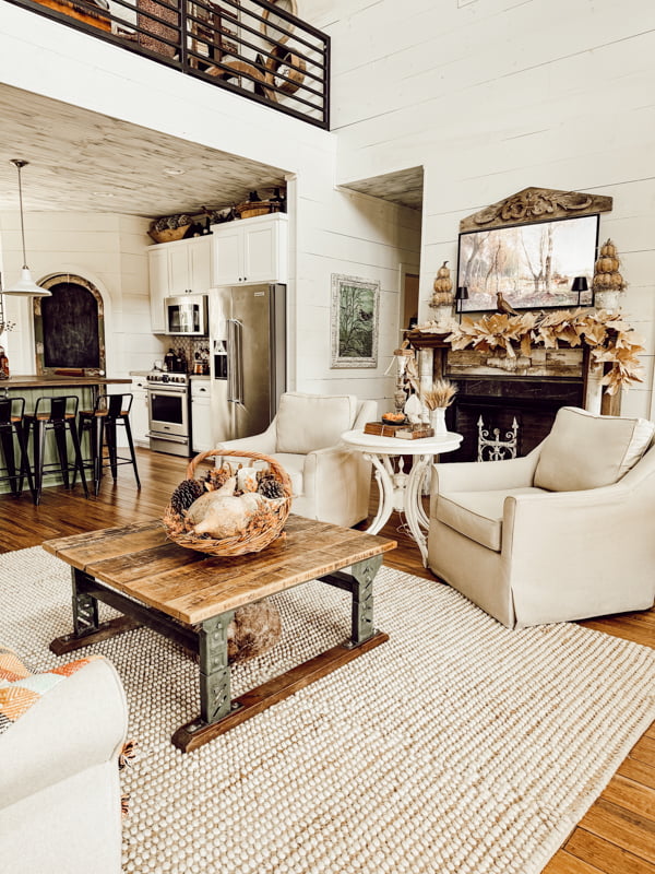 Living Room for Fall Home Tour 2024 in neutral colors with coffee table centerpiece filled with natures bounty.