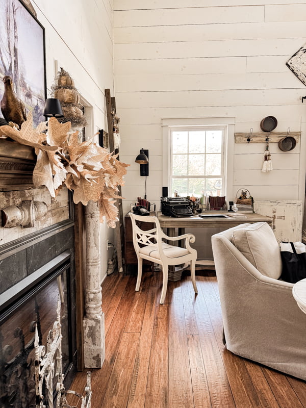 Budget Friendly Fall Decor Ideas for Living Room with corner desk with vintage typewriter and rotary phone. 