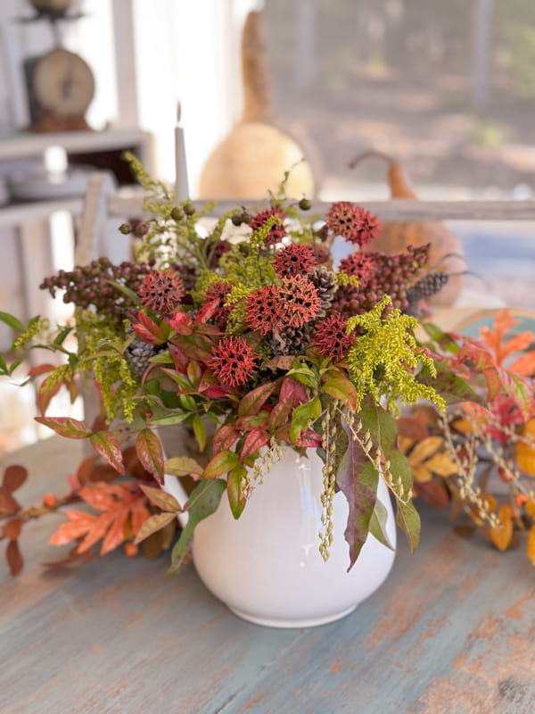 DIY Fall Floral Arrangement made with 100% foraged elements for free on screened-in porch table.