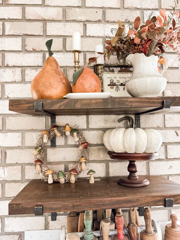 DIY Fall Mushroom Decor on open kitchen shelves with pumpkins and gourds.  