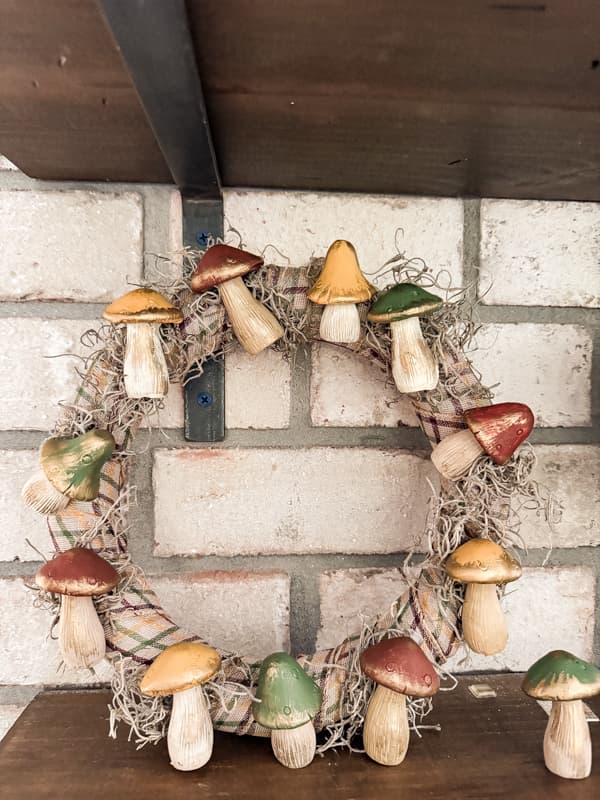 Fall DIY Mushroom Wreath on kitchen open shelves.  