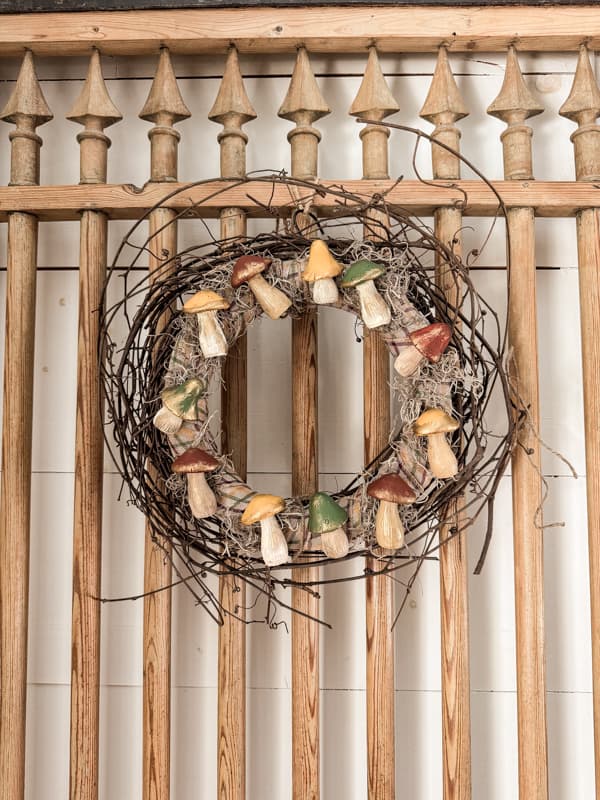 DIY Fall Mushroom Decor grapevine wreath on barn door.  Made with Dollar Tree supplies