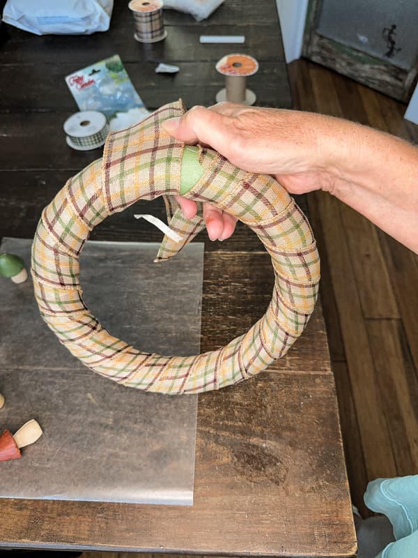 Wrap Dollar Tree wreath form with fall Ribbon to completely cover the styrofoam. 