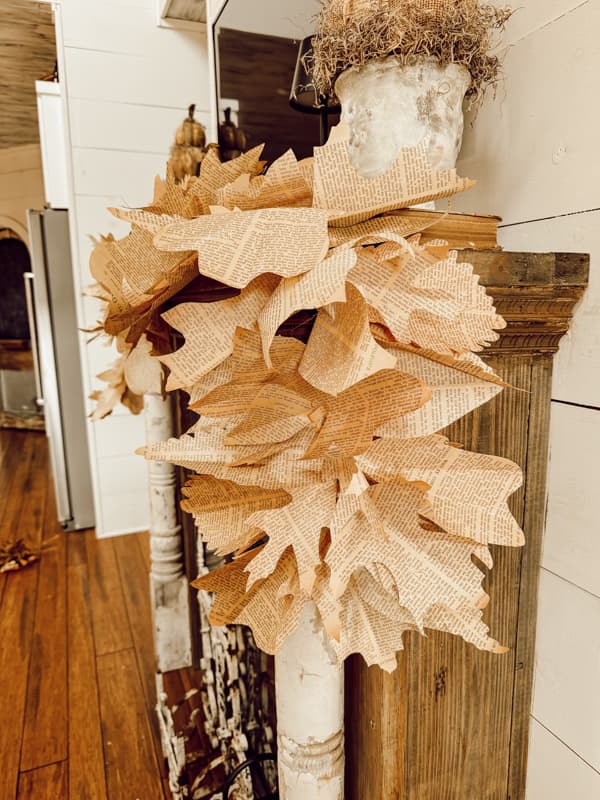 DIY Fall Garland made of old book pages for farmhouse rustic mantel decor.  