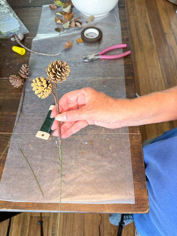 Make pinecone stems to add to the wildflower arrangement.