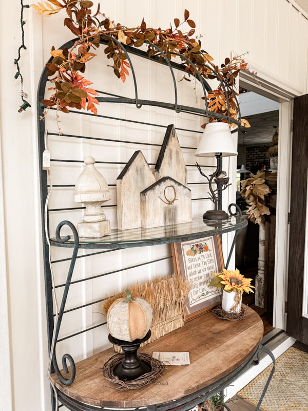 Baker's rack with fall porch decorations for Fall Screened in porch Autumn Tour