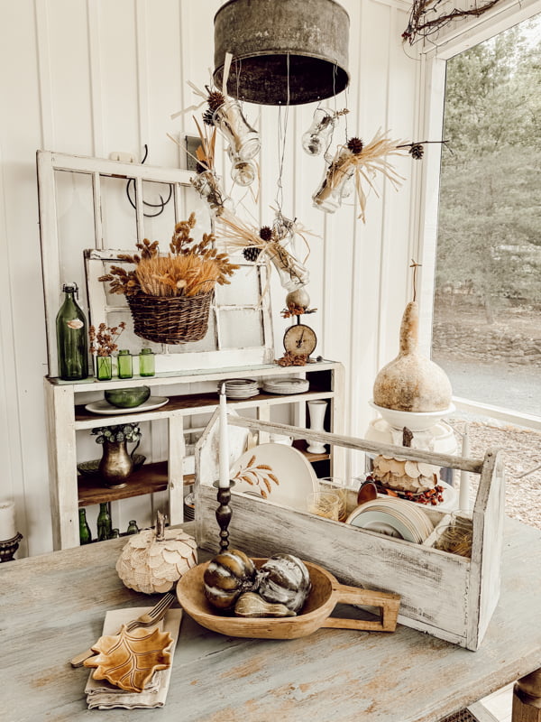 Fall Decor For Porches Autumn porch tour for a farmhouse cozy retreat.  Dining table with DIY funnel light fixture and tool box centerpiece