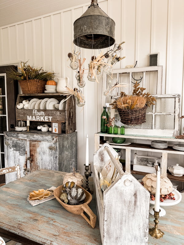 Fall Decor For Porches Autumn porch tour for a farmhouse cozy retreat.  Dining table with DIY funnel light fixture and tool box centerpiece.  