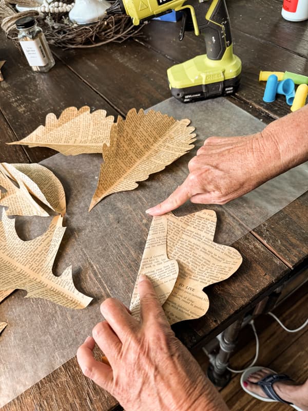 Fold leaves to create texture and shape the leaves.  