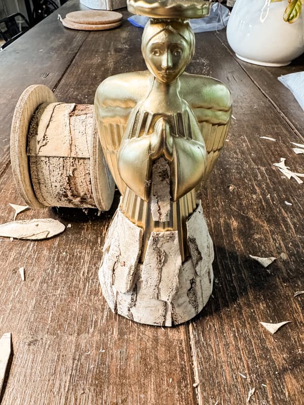 DIY Christmas Angel being covered with roll of birch bark ribbon