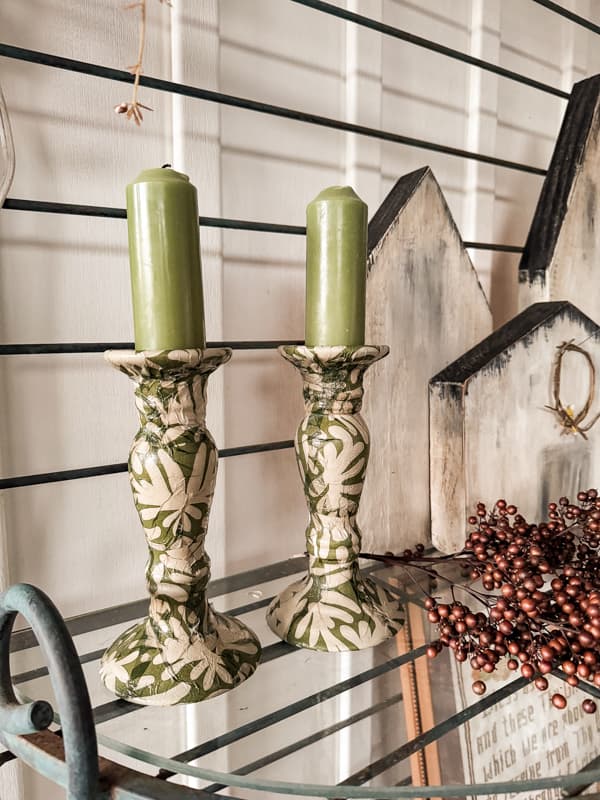 Green and cream napkins cover the updated candlestick holders for a fresh new look 