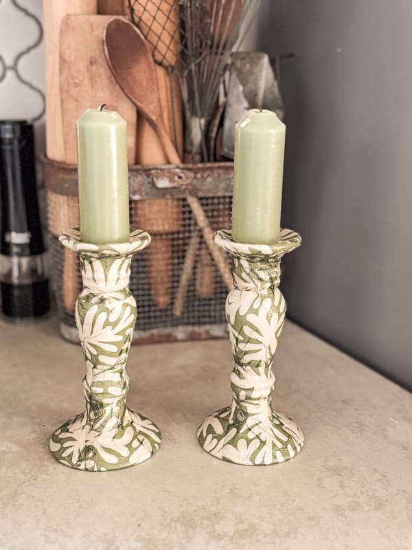 Green and cream napkins cover the updated candlestick holders for a fresh new look 