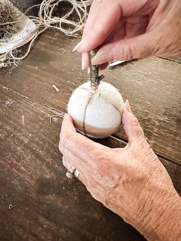 Add a foraged stick for the pumpkin stem with hot glue