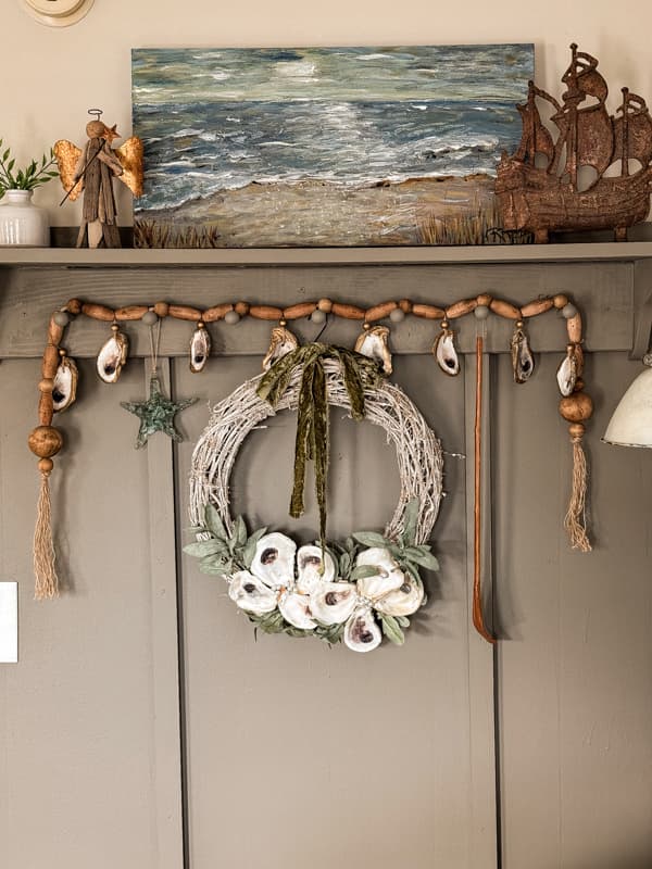 Oyster shell wreath on gray accent wall.