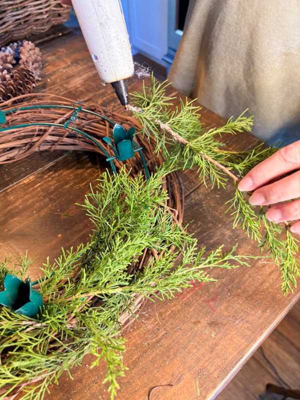 attach cedar greenery with hot glue.