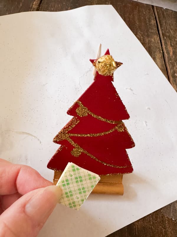 Attaching Christmas Tree Appetizer Marker to stand with double stick tape.