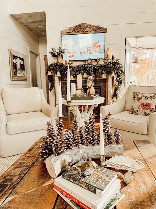 Coffee table with DIY Pinecone Christmas tree centerpiece and candles