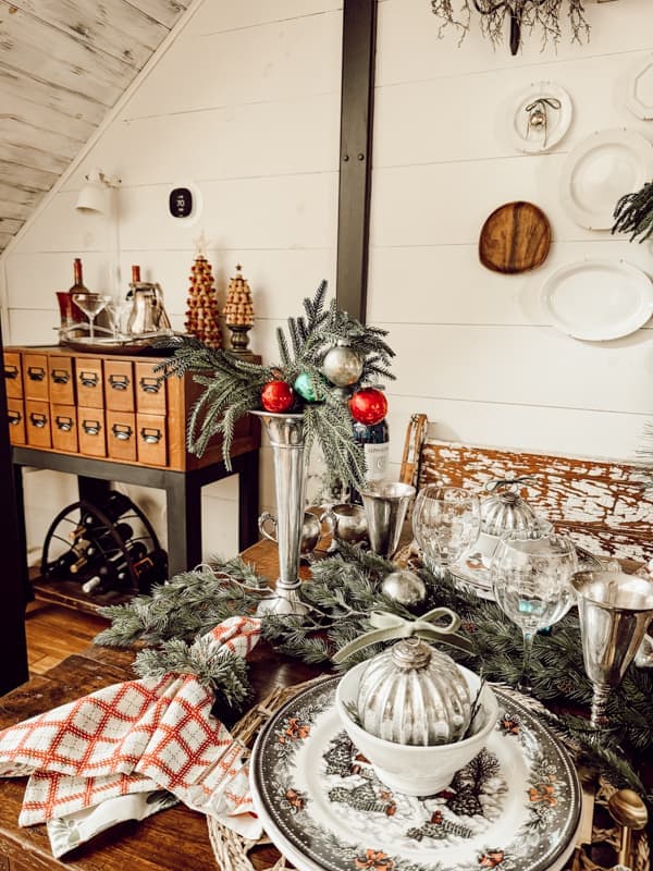 Retro Christmas Decor ideas with silver fluted vases and vintage glass Christmas ornaments.in dining room. 