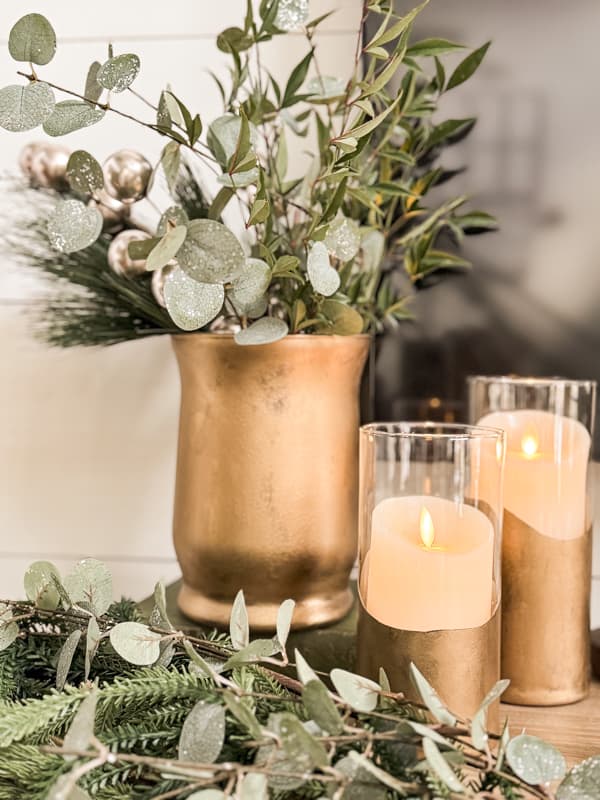 Dollar Tree Vases Transformed into Stunning DIY Glass Pillar Candle Holders on mantel.  