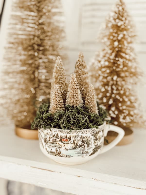 Vintage Coffee Cup Display with tiny Dollar Tree Gold Bottle Brush Christmas Trees