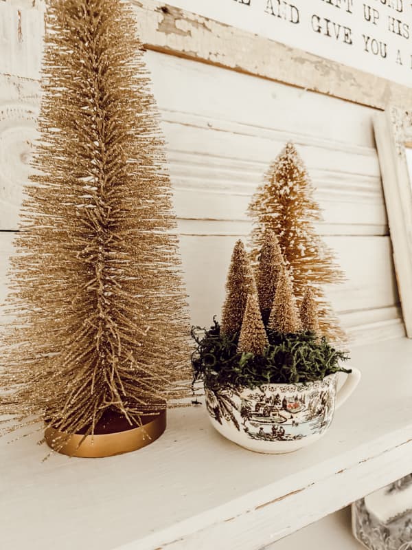 Gold Bottle Brush trees an a coffie cup filled with tiny gold trees from Dollar Tree