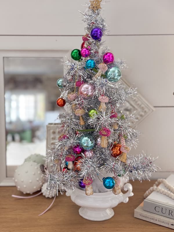 DIY Aluminum Dollar Tree Christmas Tree filled with DIY Acorn Craft Mushroom Christmas Ornaments and multi-colored balls.