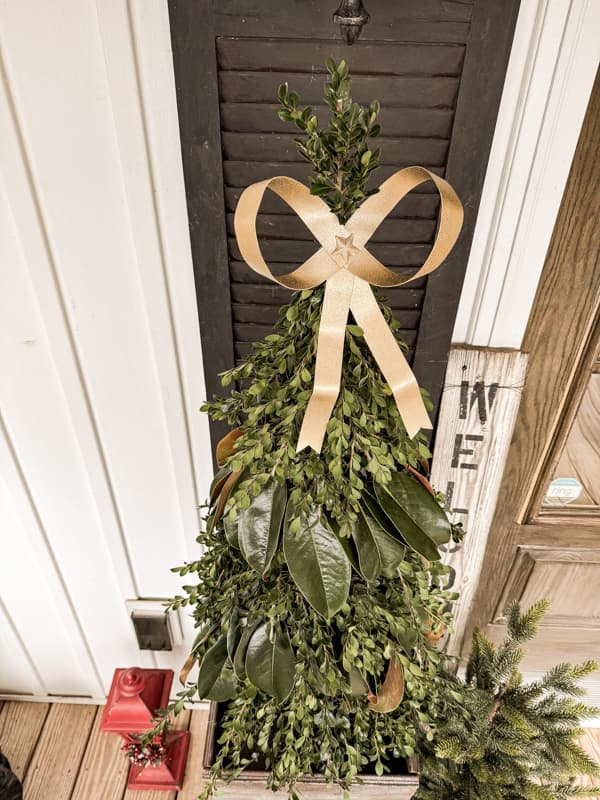 Christmas Greenery Trees in DIY planters for outdoor front porch decor 