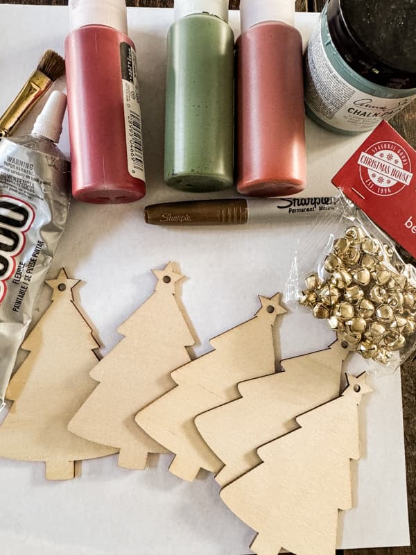 Dollar Tree Supplies to make personalized Cheese Markers with wood trees, bells, paint and glue