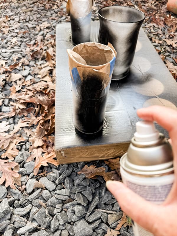 Spray paint Dollar Tree Vases with hammered paint.