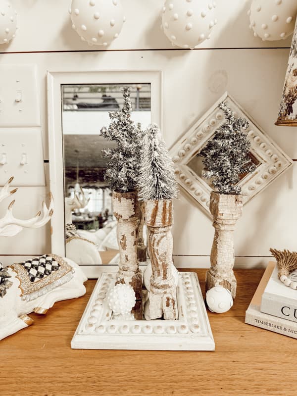 Chippy White Architectural Salvage Christmas Tree Stands on entry table in farmhouse