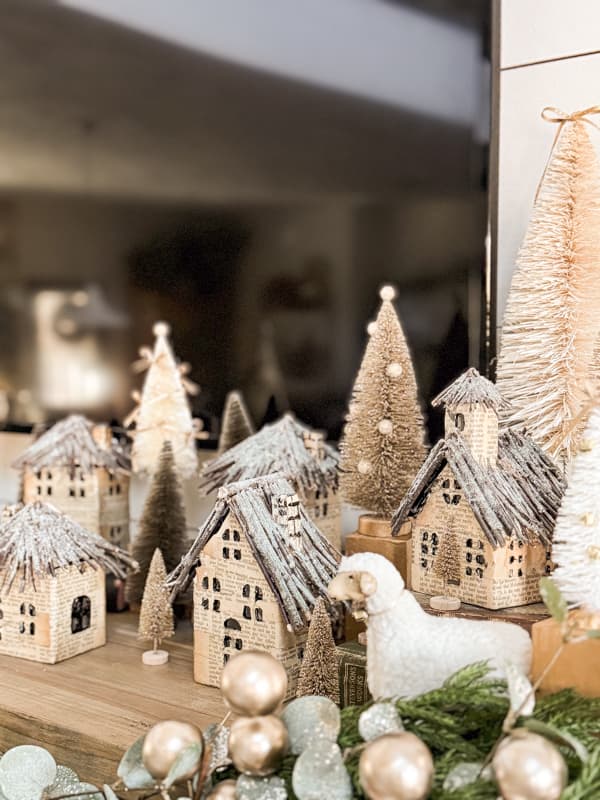 Add updated bottle brush trees to DIY Old Book Page Christmas Village for a Mantel Vignette.