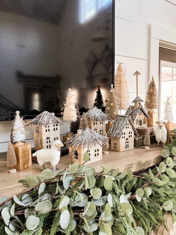 DIY Old Book Page Christmas Village with Bottle Brush Trees transformed with the latest designer trends. 