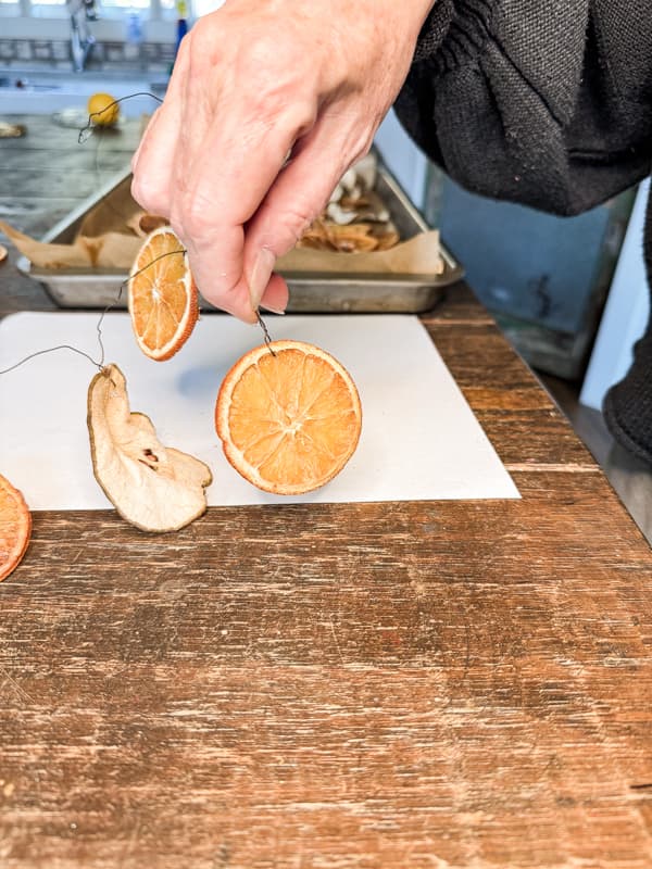 String dried fruit onto wire and twist wire to make an easy garland.