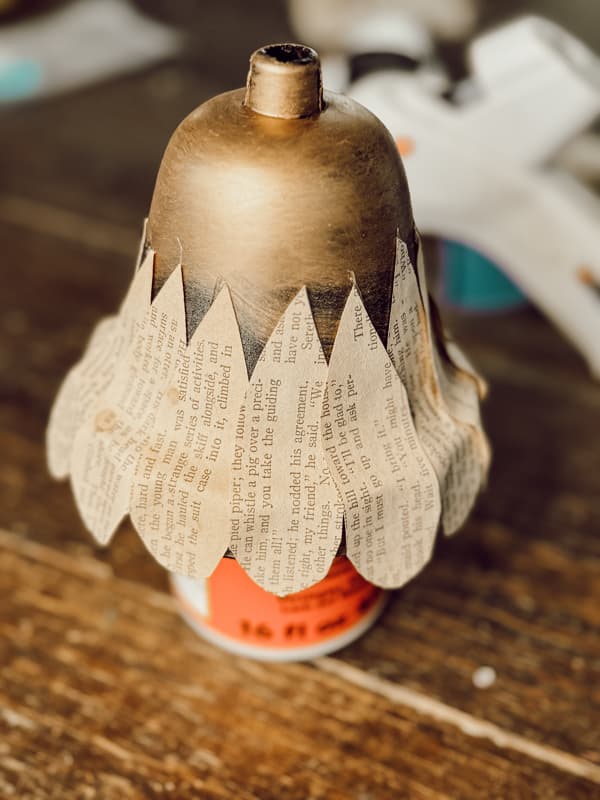 add first row of Old Book Pages for DIY Christmas Bells.