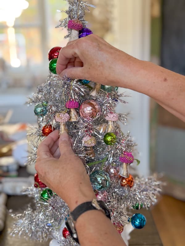 Hang acorn crafts on DIY aluminum Christmas tree