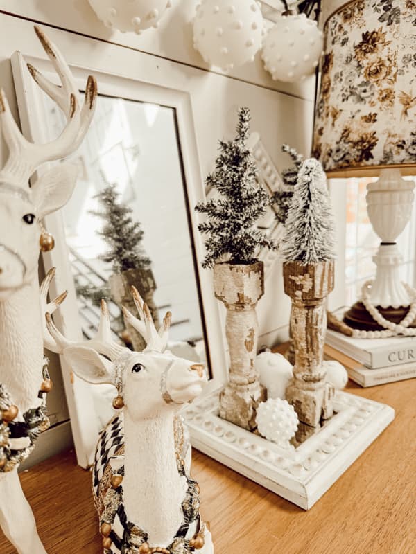 Chippy White Architectural Salvage Christmas Tree Stands on entry table in farmhouse.